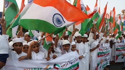 Children displaying India's flag eagerly awaited the roadshow for the three-day-long Vibrant Gujarat Global Summit starting January 10, involving Prime Minister Narendra Modi and UAE President Sheikh Mohamed bin Zayed Al Nahyan in Ahmedabad. (Reuters)