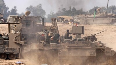 Israeli soldiersare seen on armoured personnel carriers (APC) at a position in southern Israel along the border with the Gaza (AFP) Israeli soldiersare seen on armoured personnel carriers (APC) at a position in southern Israel along the border with the Gaza (AFP)