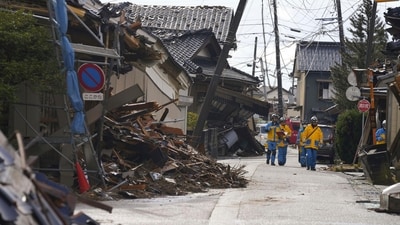 Police officers work in a quake-hit area in Suzu, Ishikawa prefecture, Japan. (AP) Police officers work in a quake-hit area in Suzu, Ishikawa prefecture, Japan. (AP)