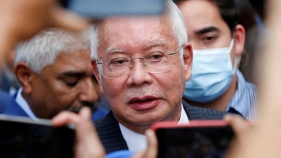 Former Malaysian prime minister Najib Razak speaks to journalists. (Reuters)