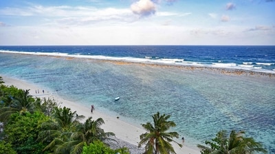A general view shows people at a beach in Maldives' Hulhumale on December 26. (AFP)