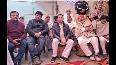 Naresh Tikait with former minister Yograj Singh ( black jacket) and his brother Lekhraj Singh at his home in Sisauli after both families announced to end their enmity. . (HT)