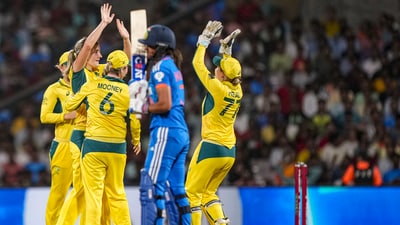 Australia's Annabel Sutherland with teammates, celebrates the wicket of India's Harmanpreet Kaur (PTI) Australia's Annabel Sutherland with teammates, celebrates the wicket of India's Harmanpreet Kaur (PTI)