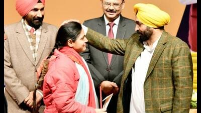 Punjab CM Bhagwant Mann handing over a job letter to a newly recruited candidate in Chandigarh on Tuesday. Punjab CM Bhagwant Mann handing over a job letter to a newly recruited candidate in Chandigarh on Tuesday.