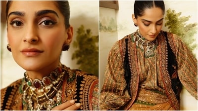 Sonam styled the saree with a silk blouse featuring embroidered patterns in rust brown and green shades, a round neckline, billowy full-length sleeves, cinched cuffs, a relaxed fitting, and a waist-length hem. She layered it with a black velvet waistcoat decked in gold and red brocade embroidery. (Instagram) Sonam styled the saree with a silk blouse featuring embroidered patterns in rust brown and green shades, a round neckline, billowy full-length sleeves, cinched cuffs, a relaxed fitting, and a waist-length hem. She layered it with a black velvet waistcoat decked in gold and red brocade embroidery. (Instagram)