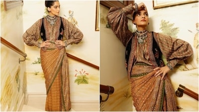 Sonam's Ritu Kumar saree comes in a mustard shade decked with gold kadhai, green patti borders, sequin embellishments, and a heavily embroidered border. Instead of draping the pallu of her six yards on the shoulder, the actor pleated and tucked it on her waist to give the illusion of a figure-hugging skirt. (Instagram) Sonam's Ritu Kumar saree comes in a mustard shade decked with gold kadhai, green patti borders, sequin embellishments, and a heavily embroidered border. Instead of draping the pallu of her six yards on the shoulder, the actor pleated and tucked it on her waist to give the illusion of a figure-hugging skirt. (Instagram)