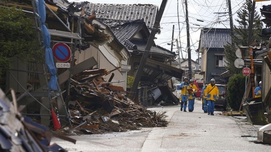 Police officers work in a quake-hit area in Suzu, Ishikawa prefecture, Japan. (AP)
