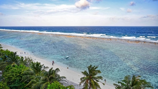 A general view shows people at a beach in Maldives' Hulhumale on December 26. (AFP)