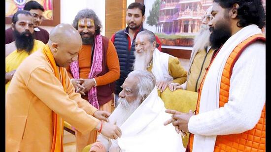Uttar Pradesh chief minister Yogi Adityanath meets Shri Ram Janmabhoomi Teerth Kshetra Trust president Mahant Nritya Gopal Das, in Ayodhya on Tuesday. (ANI Photo)