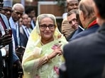 Bangladesh's Prime Minister Sheikh Hasina accepts greetings from the assembled media and election observers during a press conference, a day after she won the 12th parliamentary elections, in Dhaka.(AFP)