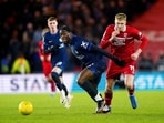Chelsea's Axel Disasi, center left, and Middlesbrough's Josh Coburn, right, battle for the ball