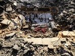Men check the damages to the house of the Palestinian Nofal family, who were killed during Israeli bombardment. (AFP) Men check the damages to the house of the Palestinian Nofal family, who were killed during Israeli bombardment. (AFP)