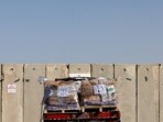 A truck carrying humanitarian aid waits to enter the Gaza Strip via the Kerem Shalom crossing.
