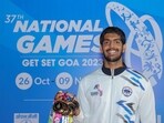 Swimmer Srihari Nataraj poses for photos with his medals at the 37th National Games in Goa