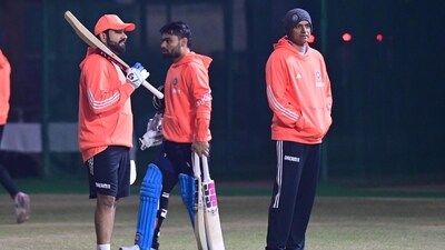 Indian captain Rohit Sharma along with Rahul Dravid during the practice session at PCA Stadium in Mohali Indian captain Rohit Sharma along with Rahul Dravid during the practice session at PCA Stadium in Mohali