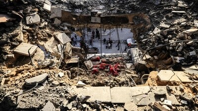 Men check the damages to the house of the Palestinian Nofal family, who were killed during Israeli bombardment. (AFP) Men check the damages to the house of the Palestinian Nofal family, who were killed during Israeli bombardment. (AFP)