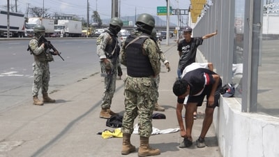 Soldiers check pedestrians for weapons at a check-point on a north-bound highway in Guayaquil, Ecuador, Wednesday, Jan. 10, 2024. (AP) Soldiers check pedestrians for weapons at a check-point on a north-bound highway in Guayaquil, Ecuador, Wednesday, Jan. 10, 2024. (AP)