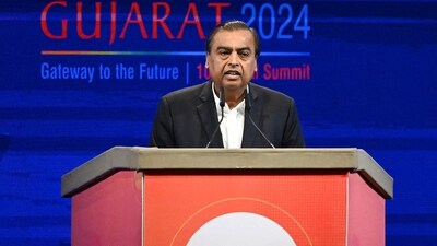 Chairman and Managing Director of Reliance Industries, Mukesh Ambani addresses a gathering during the inaugural session of Vibrant Gujarat Global Summit 2024. (AFP) Chairman and Managing Director of Reliance Industries, Mukesh Ambani addresses a gathering during the inaugural session of Vibrant Gujarat Global Summit 2024. (AFP)