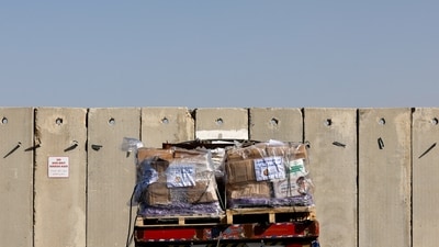 A truck carrying humanitarian aid waits to enter the Gaza Strip via the Kerem Shalom crossing. (REUTERS)