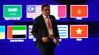 India's Adani Group chairman Gautam Adani leaves after addressing the Vibrant Gujarat Global Summit in Gandhinagar on Wednesday, (AP) India's Adani Group chairman Gautam Adani leaves after addressing the Vibrant Gujarat Global Summit in Gandhinagar on Wednesday, (AP)