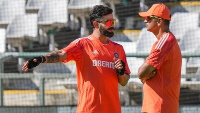 India's Virat Kohli with head coach Rahul Dravid during a warmup session (PTI)
