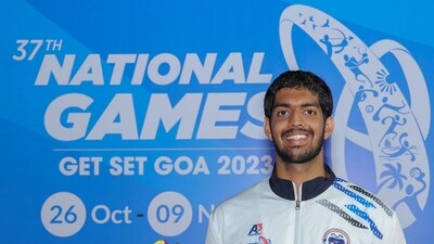 Swimmer Srihari Nataraj poses for photos with his medals at the 37th National Games in Goa (PTI) Swimmer Srihari Nataraj poses for photos with his medals at the 37th National Games in Goa (PTI)