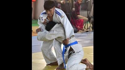 Punjab and Manipur players in action during a judo match in National School Games at Multipurpose Sports Hall in Ludhiana on Wednesday. (Manish/HT) Punjab and Manipur players in action during a judo match in National School Games at Multipurpose Sports Hall in Ludhiana on Wednesday. (Manish/HT)