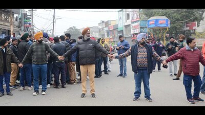 Shopkeepers in Model Town holding a protest after their shops were sealed by the municipal corporation on Wednesday. (Gurpreet Singh/HT) Shopkeepers in Model Town holding a protest after their shops were sealed by the municipal corporation on Wednesday. (Gurpreet Singh/HT)