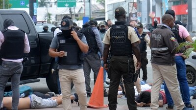 Ecuadorean police officers fuard the arrested suspects outside Ecuador's TC television channel after unidentified gunmen burst into the state-owned television studio live on air (AFP) Ecuadorean police officers fuard the arrested suspects outside Ecuador's TC television channel after unidentified gunmen burst into the state-owned television studio live on air (AFP)