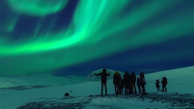 The northern lights, or the aurora borealis can be technically described as a light display resulting from charged particles (electrons and protons) colliding with different gases. The northern lights, or the aurora borealis can be technically described as a light display resulting from charged particles (electrons and protons) colliding with different gases.