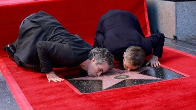 Mark Ruffalo and Willem Dafoe, who recently starred together in Poor Things, kiss Dafoe's newly unveiled star during the ceremony honoring him with a Hollywood Walk of Fame star in Hollywood. (AFP) Mark Ruffalo and Willem Dafoe, who recently starred together in Poor Things, kiss Dafoe's newly unveiled star during the ceremony honoring him with a Hollywood Walk of Fame star in Hollywood. (AFP)
