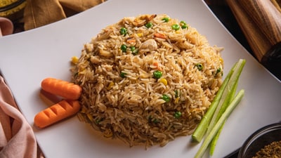 A woman was slammed for posting a video of a person eating rice with hands. (Unsplash) A woman was slammed for posting a video of a person eating rice with hands. (Unsplash)