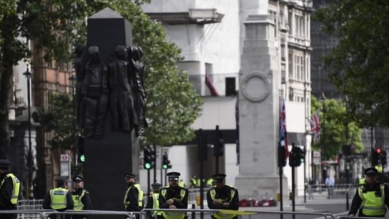 British police officers secure the area around The Cenotaph war memorial on Whitehall in central London. (AP)