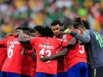 Gambia players huddle before the start of the second half 