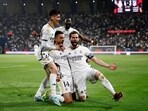 Real Madrid's Joselu and teammates celebrate after Atletico Madrid's Stefan Savic scores an own goal and Real Madrid's fourth goal