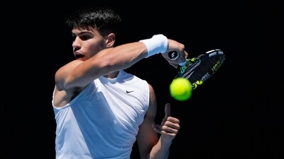 Spain's Carlos Alcaraz plays a forehand return during a practice session ahead of the Australian Open tennis championships at Melbourne Park (AP) Spain's Carlos Alcaraz plays a forehand return during a practice session ahead of the Australian Open tennis championships at Melbourne Park (AP)