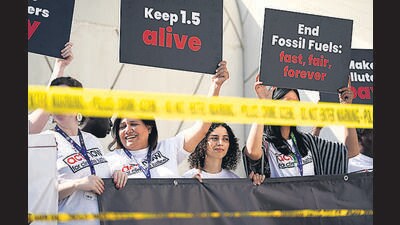 FILE - Activists protest against fossil fuels at the COP28 U.N. Climate Summit, Dec. 5, 2023, in Dubai, United Arab Emirates. Earth last year shattered global annual heat records, the European climate agency said Tuesday, Jan. 9, 2024. (AP Photo/Joshua A. Bickel, File) (AP) FILE - Activists protest against fossil fuels at the COP28 U.N. Climate Summit, Dec. 5, 2023, in Dubai, United Arab Emirates. Earth last year shattered global annual heat records, the European climate agency said Tuesday, Jan. 9, 2024. (AP Photo/Joshua A. Bickel, File) (AP)