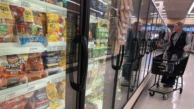 A customer shops for frozen food at a grocery store on December 12, 2023 in San Anselmo, California. (AFP) A customer shops for frozen food at a grocery store on December 12, 2023 in San Anselmo, California. (AFP)
