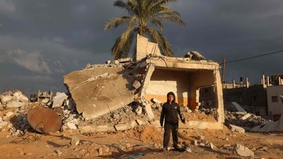 A Palestinian boy walks near a destroyed building which was hit in an Israeli air strike, in Rafah in the southern Gaza Strip. (AFP) A Palestinian boy walks near a destroyed building which was hit in an Israeli air strike, in Rafah in the southern Gaza Strip. (AFP)