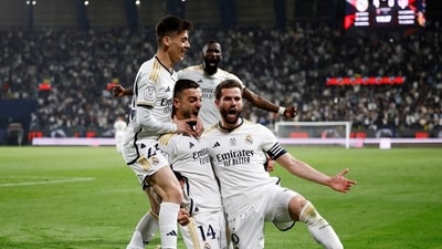 Real Madrid's Joselu and teammates celebrate after Atletico Madrid's Stefan Savic scores an own goal and Real Madrid's fourth goal (REUTERS)
