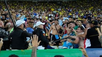 FILE - Police break up a fight between Brazilian and Argentinian fans that broke out prior to a qualifying soccer match for the FIFA World Cup 2026 (AP) FILE - Police break up a fight between Brazilian and Argentinian fans that broke out prior to a qualifying soccer match for the FIFA World Cup 2026 (AP)