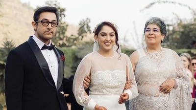 The bride's parents, Aamir Khan and Reena Dutta were seen walking Ira down the aisle in another picture. Reena Dutta chose a grey lace saree, while Aamir wore a classic black tuxedo. The bride, dressed in a white gown, also wore a net veil. The bride's parents, Aamir Khan and Reena Dutta were seen walking Ira down the aisle in another picture. Reena Dutta chose a grey lace saree, while Aamir wore a classic black tuxedo. The bride, dressed in a white gown, also wore a net veil. 