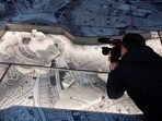 A cameraperson shoots the Colosseum inside a Roman marble map created by order of Emperor Septimius Severus, in the Forma Urbis museum during the opening of the new Celio Antiquarium, near the Colosseum in Rome, Italy. Colosseum's neighbour: Exclusive museum to showcase long-hidden marble map of ancient Rome 