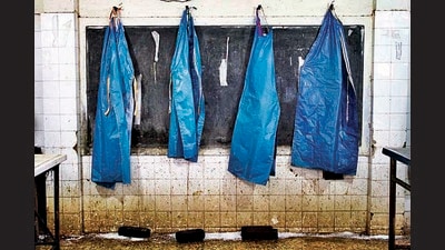 A photograph from Millennia of Oppression by Arun Vijai Mathavan, a series on the people, often Dalits, who conduct post-mortem procedures at government hospitals. (Courtesy All That Blue) A photograph from Millennia of Oppression by Arun Vijai Mathavan, a series on the people, often Dalits, who conduct post-mortem procedures at government hospitals. (Courtesy All That Blue)