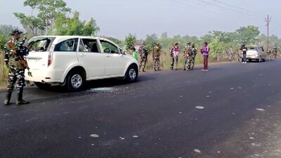 Security personnel stand guard at the site where vehicles of the Enforcement Directorate (ED) team were attacked during a raid in West Bengal's Sandeshkhali (ANI) Security personnel stand guard at the site where vehicles of the Enforcement Directorate (ED) team were attacked during a raid in West Bengal's Sandeshkhali (ANI)