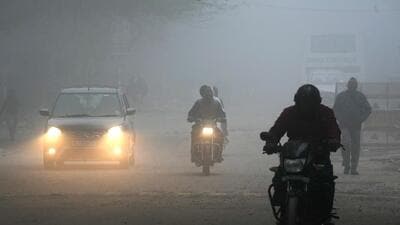 Low visibility due to a thick layer of fog in New Delhi on Friday morning. (PTI) Low visibility due to a thick layer of fog in New Delhi on Friday morning. (PTI)