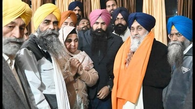 SAD chief Sukhbir Singh Badal with family members of Kaunke in Ludhiana on Friday. (HT photo)