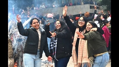 Students celebrating Lohri on the Panjab University campus in Chandigarh on a chilly Friday morning. (Keshav Singh/HT) Students celebrating Lohri on the Panjab University campus in Chandigarh on a chilly Friday morning. (Keshav Singh/HT)