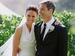 Former New Zealand Prime Minister Jacinda Ardern embraces her husband Clarke Gayford at their wedding in Havelock North, New Zealand. (AP)
