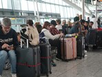 Passengers are seen waiting for delayed flights in London's Heathrow airport. (AP) Passengers are seen waiting for delayed flights in London's Heathrow airport. (AP)